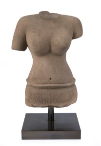 An antique Khmer carved stone female torso, 38cm high, 51cm high overall