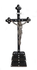 An antique folk art crucifix, cigar box cedar with silvered Christ and white enamel decoration, late 19th century, ​67cm high