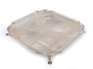 A sterling silver salver of square form with lobed corners, made in Sheffield, circa 1925, 4.4cm high, 35cm wide, 1742 grams