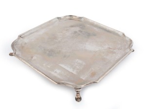 A sterling silver salver of square form with lobed corners, made in Sheffield, circa 1925, ​4.4cm high, 35cm wide, 1742 grams