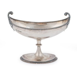 A sterling silver bon bon dish with scrolling handles by James Dixon & Sons of Sheffield, circa 1909, 11cm high, 13cm wide, 144 grams