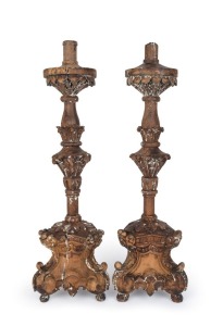 A pair of antique French candlesticks, carved fruitwood with remains of gesso finish, 18th century, 76cm high