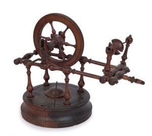 A Georgian tabletop miniature spinning wheel, 18th century, ​26cm high, 30cm wide