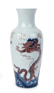 A Chinese blue and white porcelain dragon vase with copper red decoration, Qing Dynasty. Note the Liu Yuan design standing dragon motif. Kangxi mark possibly Guangxi period. ​​​​​​​ A similar example sold at Christie's Auctions, London, 6/11/2018, lot268 