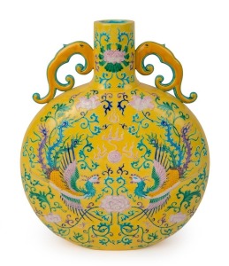 A Chinese moon flask vase with fine polychrome enamel decoration of Feng-Hung phoenix birds, peonies, lotus and flaming pearl with stylized turtledove handles on yellow ground, Republic period, impressed seal mark to base, 36.5 cm high, 29.5cm wide