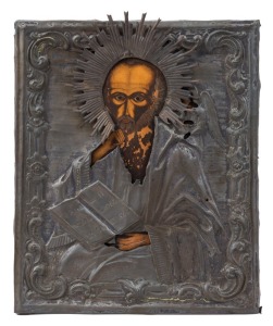 ICON: egg tempera on wooden panel overlaid by a silver-gilt riza, depicting St. John the Divine, Russian, circa 1900, 31.5 x 26cm.