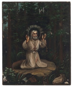 MINIATURE ICON: tempera on wooden panel, depicting Saint Seraphim of Sarov praying in the forest, Russian, late-19th Century, 14.5 x 12cm.