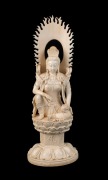 An antique Chinese Guanyin statue superbly carved in ivory, Qing Dynasty, 19th century, 36.5cm high