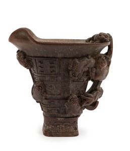 A Ming style Chinese libation cup, carved bamboo with Chi-long dragon decoration, Qing Dynasty, 19th century. Similar example sold at Bonham's Sydney, Australia, 22nd April 2021, lot 105. See Connoisseurship Of Horn Carvings In China by Thomas Fok. ISBN 9