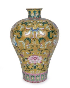 A Chinese Meiping porcelain vase adorned with lotus, orchids and spring flowers, 20th century, blue enamel overglaze Qianlong mark, 37.5cm high