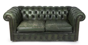 A green leather Chesterfield style two seat settee, 20th century, ​​​​​​​180cm across the arms