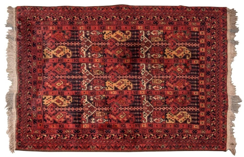 An Afghan hand-knotted wool rug with burgundy background, 150 x 106cm