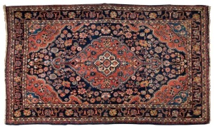 A Persian hand-knotted wool rug with blue background and floral decoration, ​​​​​​​170 x 108cm