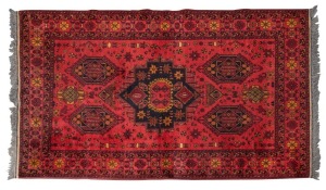 A Persian red and black hand-knotted rug, ​​​​​​​220 x 128cm
