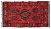 A Persian red and black hand-knotted rug, ​​​​​​​220 x 128cm