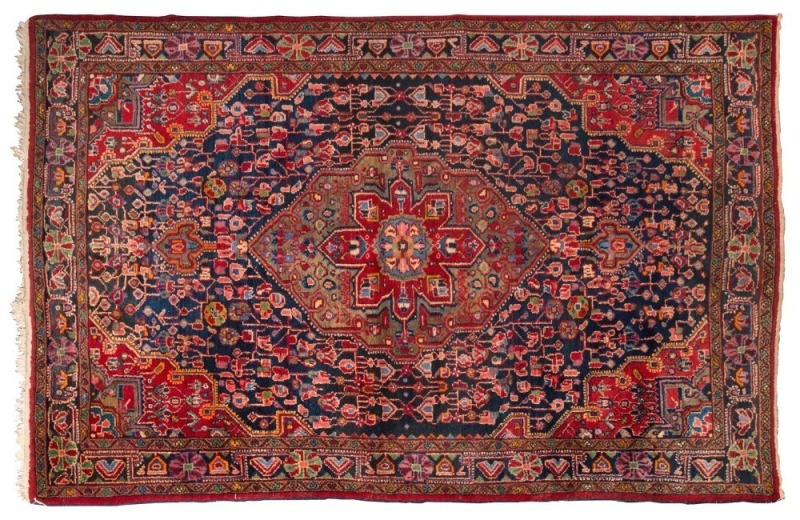 An Afghan brown, green and red hand-knotted wool rug, ​​​​​​​218 x 144cm 