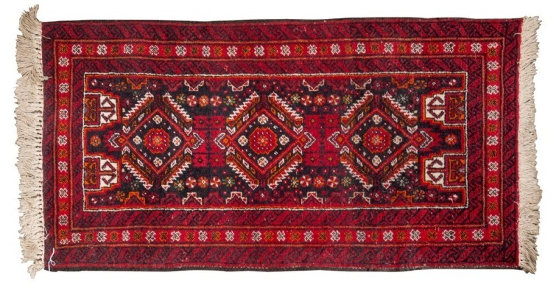 A small Persian hand-knotted rug with geometric design ​​​​​​​116 x 55cm