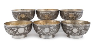 A set of six Chinese silver bowls with floral decoration, 19th century, seal mark to base, ​​​​​​​7.5cm high, 13.5cm diameter 1,470 grams total