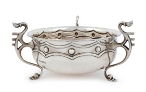 An Arts & Crafts English sterling silver fruit bowl by Reid & Sons (Thomas Arthur Reid, Francis James Langford & Christian Leopold Reid) of London, circa 1905, 14cm high, 26cm wide, 904 grams