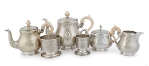 An antique French silver plated 6 piece tea service with carved ivory handles, 19th century, the larger teapot 21cm high, 29cm wide