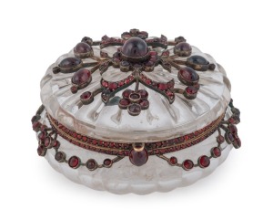 A stunning antique Bohemian jewellery box, carved rock crystal mounted in gold set with garnets, 19th century, ​​​​​​​4cm high, 7.5cm diameter