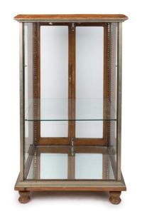 An antique nickel bound shop display cabinet on bun feet, by Brooks Robinson, late 19th century, 121cm high, 69cm wide, 68cm deep