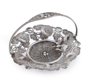 A Continental silver bon bon basket in the form of a bird and nest in vines, 19th century, tests as 800 silver, 15cm across the handle, 152 grams