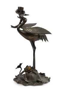 An antique Japanese bronze crane candle holder with gold highlights, Meiji period, 19th century, ​​​​​​​36cm high