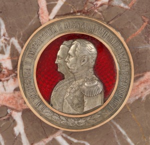 FABERGE antique Russian commemorative marble tazza set with a superbly crafted Russian silver and enamel plaque mounted in gold depicting Catherine The Great and Alexander II, 19th century, full Cyrillic Faberge mark with additional Russian gold and silver marks, base mounted with Russian silver collar also stamped in Cyrillic, 17cm high, 29cm diameter overall, the plaque 7.5cm diameter. PROVENANCE: The Eric Dare Collection, Christie's, Australia, 1995, lot 215