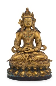 A Sino-Tibetan cast bronze Buddha inset with coral and turquoise, 19th century, 24cm high