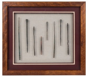 Eight assorted Roman bronze medical instruments, 2nd century A.D. the largest 16cm long, frame 31 x 28cm overall