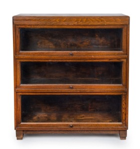 An American oak bookcase with three glazed doors, early 20th century, ​​​​​​​101cm high, 90cm wide, 28cm deep