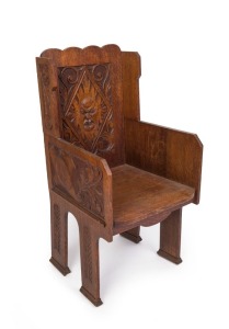 An antique English oak Arts & Crafts "Green Man" chair, late 19th century, ​​​​​​​107cm high, 50cm across the arms
