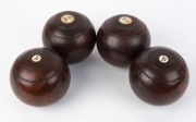 Four antique lawn bowls, lignum vitae with bone buttons, 19th/20th century, ​13cm high