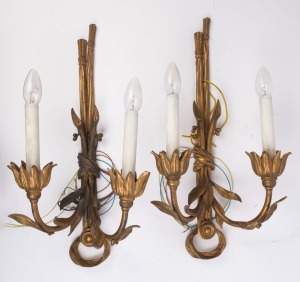 A pair of French gilt metal two branch wall sconces, 56cm high, 28cm wide