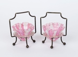 A pair of antique English glass table salts in silver plated stands, 19th century, 11cm high