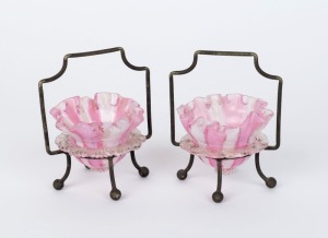 A pair of antique English glass table salts in silver plated stands, 19th century, ​11cm high