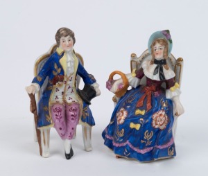 A pair of antique porcelain statues of seated figures, 19th century, gold anchor marks, 10cm high