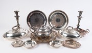 A pair of silver plated tureens, pair of candlesticks, three assorted trays, a teapot, sauceboat and assorted dishes, 19th and 20th century, (12 items), the candlesticks 25cm high.