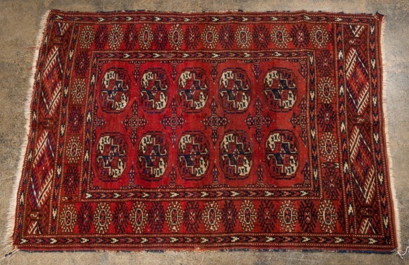 A Persian hand-knotted rug with burgundy background, ​130 x 93cm