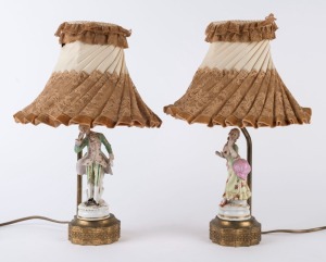 A pair of vintage figural porcelain table lamps with original shades, early to mid 20th century, ​39cm high overall