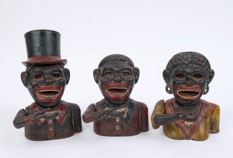 Three American style painted cast iron novelty money boxes, the largest 20cm high