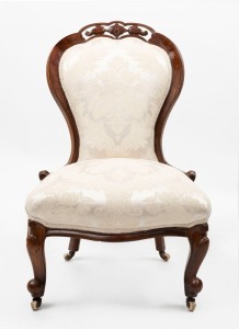 An antique English parlour chair, carved walnut with cream jacquard upholstery, 19th century, ​90cm high, 57cm wide