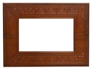 An Australian folk art chip carved picture frame, late 19th century, ​46 x 62cm overall