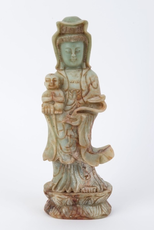 A Chinese carved jade Guanyin with child statue, 19th/20th century, ​31cm high