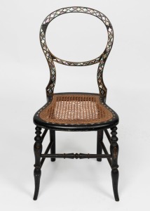 An antique ebonized balloon back chair with mother of pearl inlay, circa 1845, ​85cm high