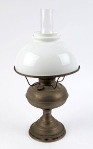 An antique oil lamp with milk glass shade and chimney, early 20th century, 51cm high overall