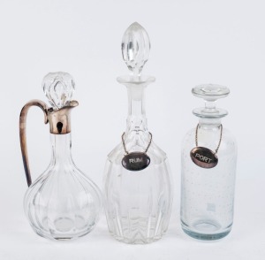 Three assorted decanters, one with sterling silver collar and handle; together with two silver labels, 19th and 20th century, (5 items), the largest 36cm high