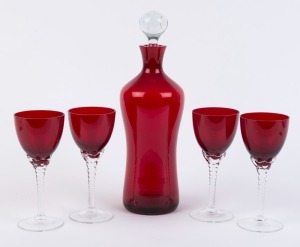 A vintage ruby glass decanter and four wine glasses, 20th century, (5 items), ​the decanter 29cm high