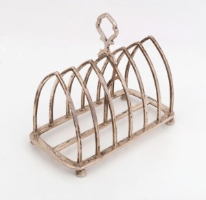 An antique sterling silver six slice toast rack by Thomas Bradbury & Sons of Sheffield, circa 1898, 12cm high, 14cm wide, 236 grams